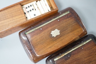 Two carved wood snuff boxes and a cased bone domino set